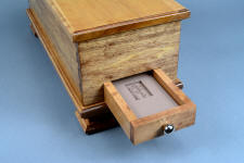"Concordia and Sanchez" hardwood case detail, sharpener drawer silicone prise view in maple, American black walnut, bird's eye maple, and 304 austenitic stainless steel fittings